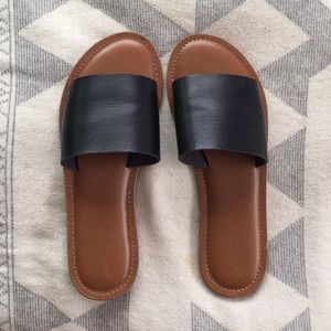 Black leather slides